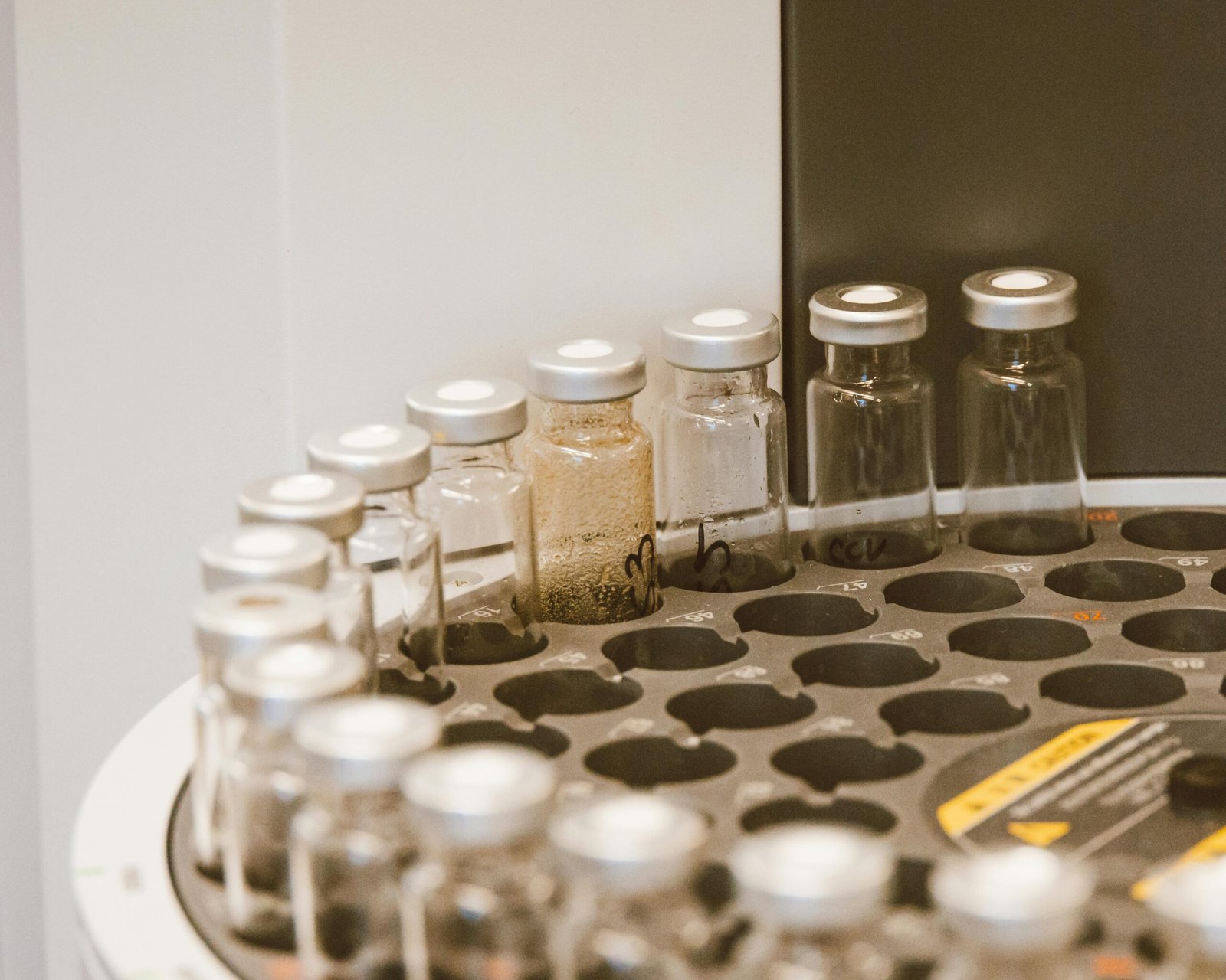 Vials arranged in a lab rack, showcasing scientific organization and research preparation.